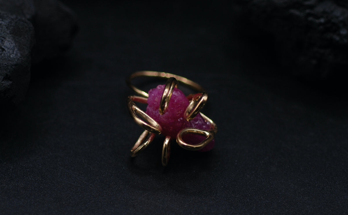 Gold plated silver cocktail ring witg a giant raw ruby stone