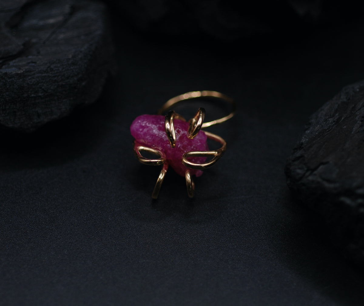 Gold plated silver cocktail ring witg a giant raw ruby stone