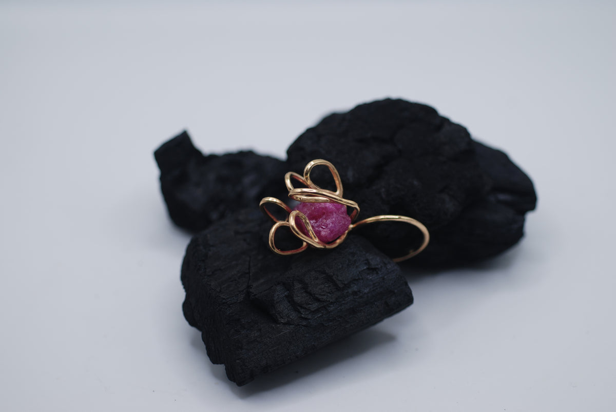 Gold plated silver cocktail ring witg a giant raw ruby stone