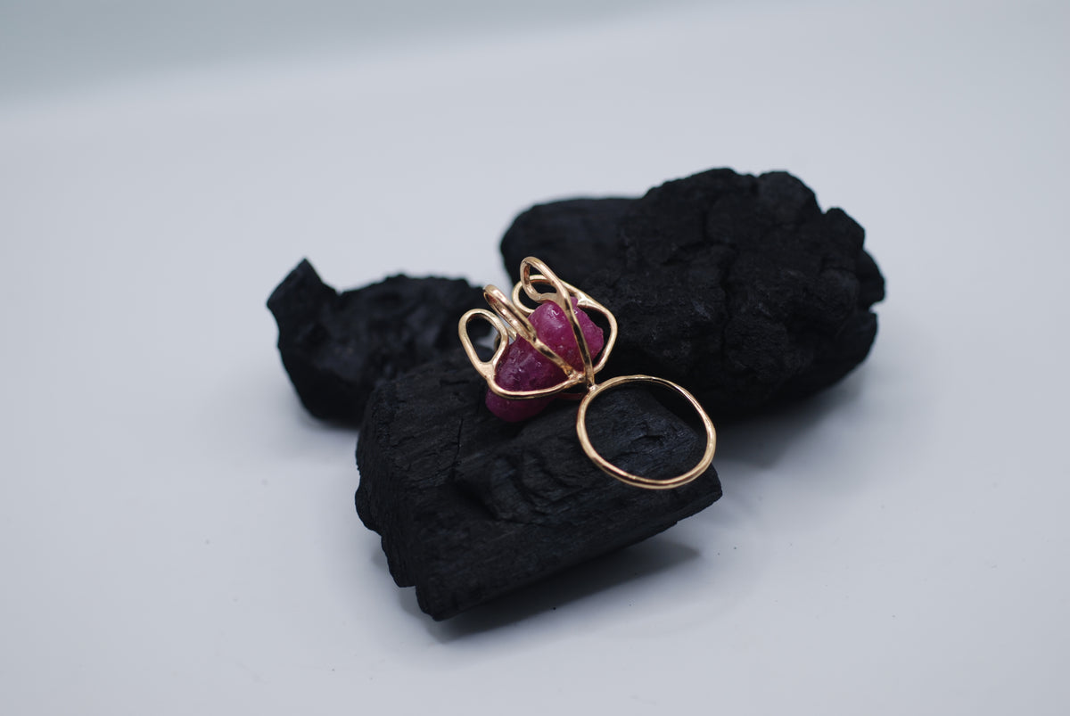 Gold plated silver cocktail ring witg a giant raw ruby stone