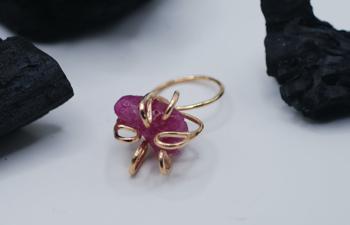 Gold plated silver cocktail ring witg a giant raw ruby stone