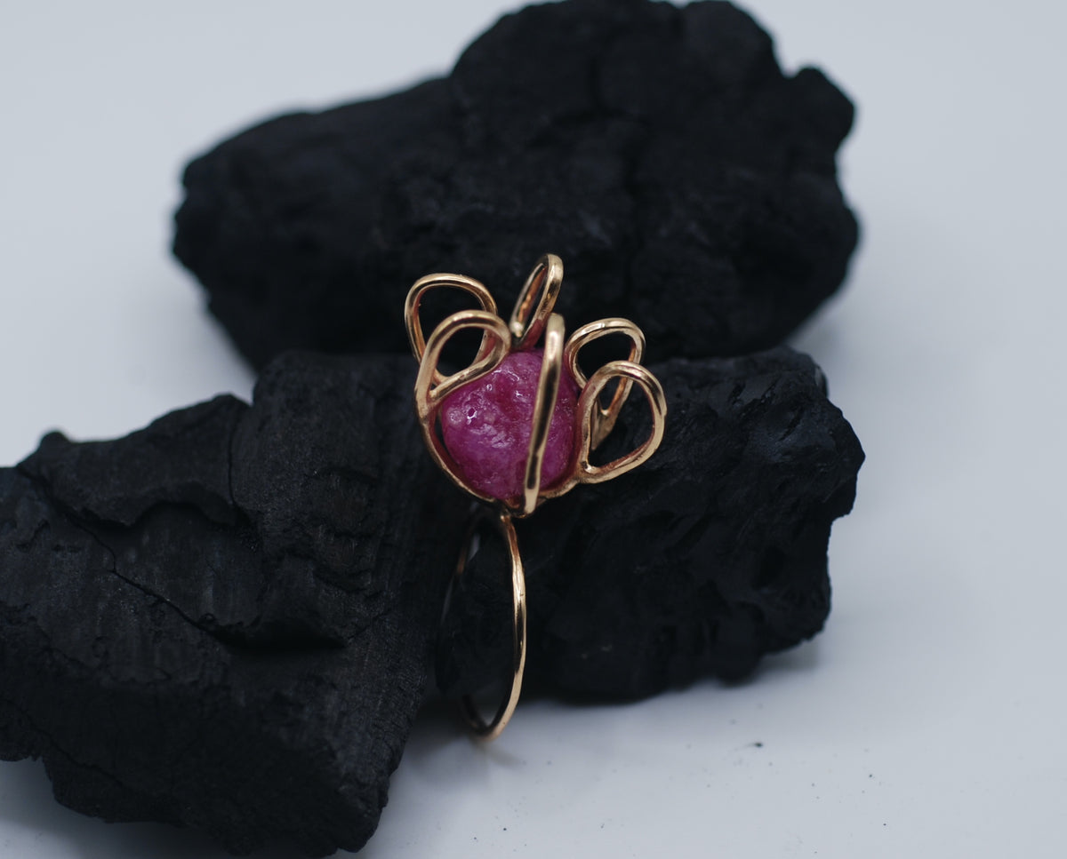 Gold plated silver cocktail ring witg a giant raw ruby stone