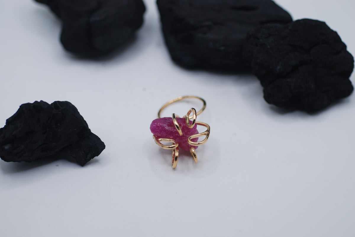 Gold plated silver cocktail ring witg a giant raw ruby stone